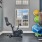 room with exercise equipment and windows