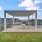 bench and picnic table under pergola with pet washing station