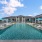 umbrella shaded lounge chairs on pool tanning shelves