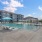 outdoor lounge under pergola next to pool
